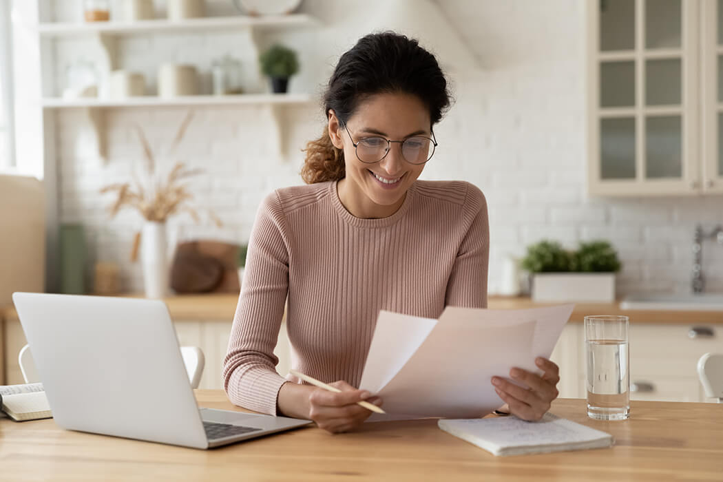 Smiling woman with laptop